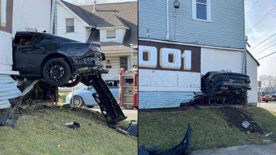Crashed Mustang Ends Up Perfectly Wedged Into The Side Of a House - motor1.com - state Indiana