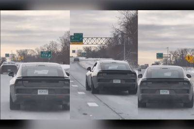 WATCH: Electric Dodge Charger Muscle Car Spied On Michigan Highway - carbuzz.com - state Michigan - county Hill