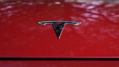 Tesla lays off more staff in software, service teams
