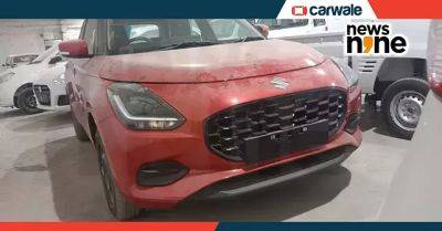 New Maruti Swift red colour in VXi variant spotted ahead of launch - carwale.com